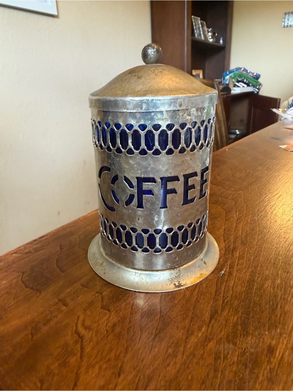 Vintage silver plated coffee canister features a striking cobalt blue liner